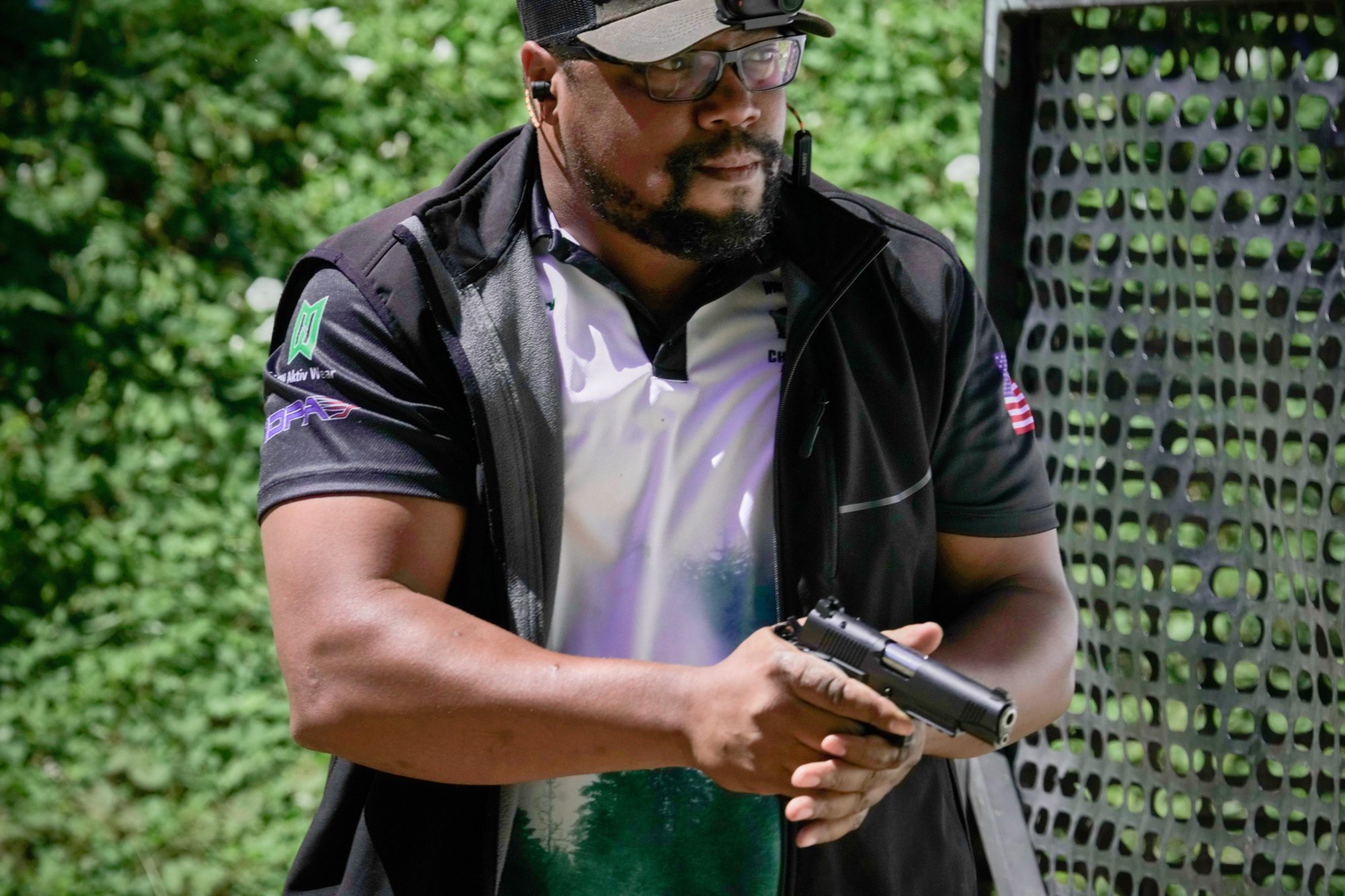 Competitive shooter drawing at an IDPA match