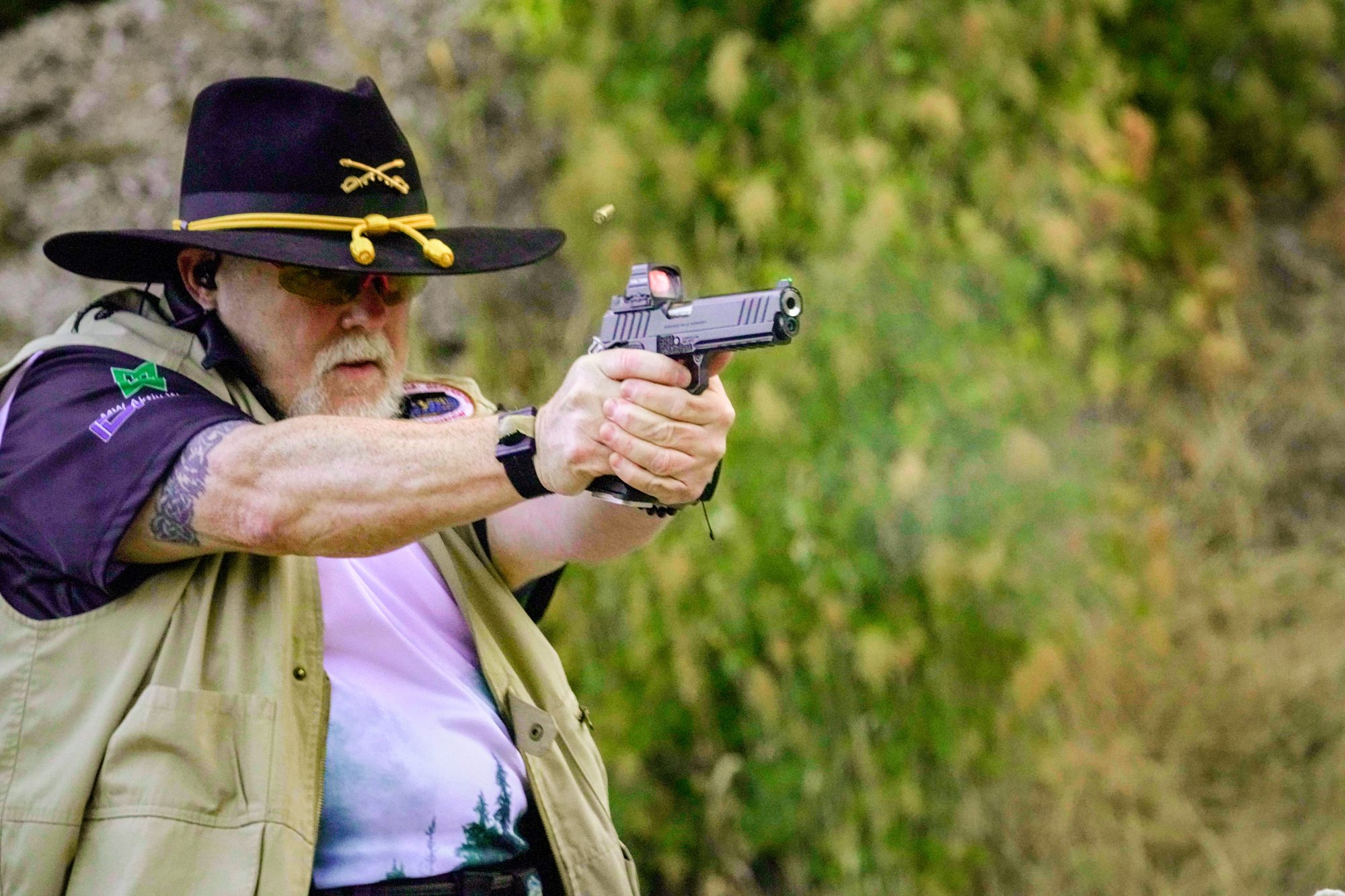 IDPA competitor reholstering after a stage